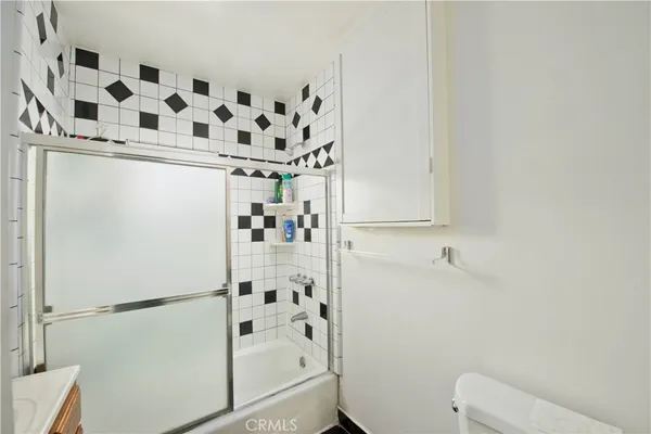 a bathroom with a bathtub and shower