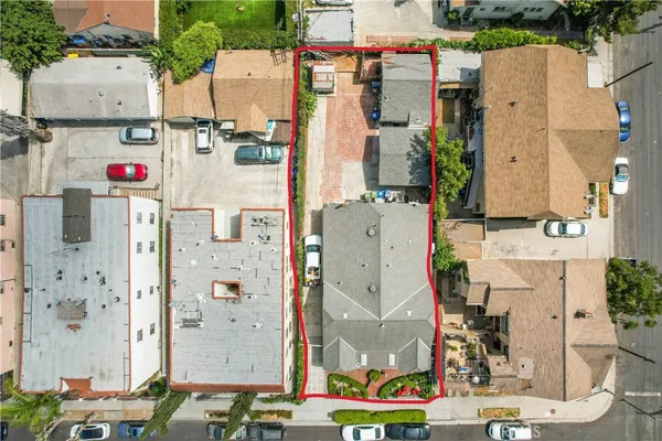an aerial view of residential houses with outdoor space