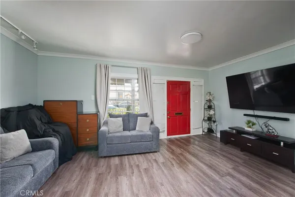 a living room with furniture and a flat screen tv