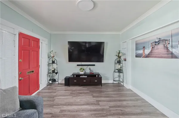 a living room with furniture and a flat screen tv