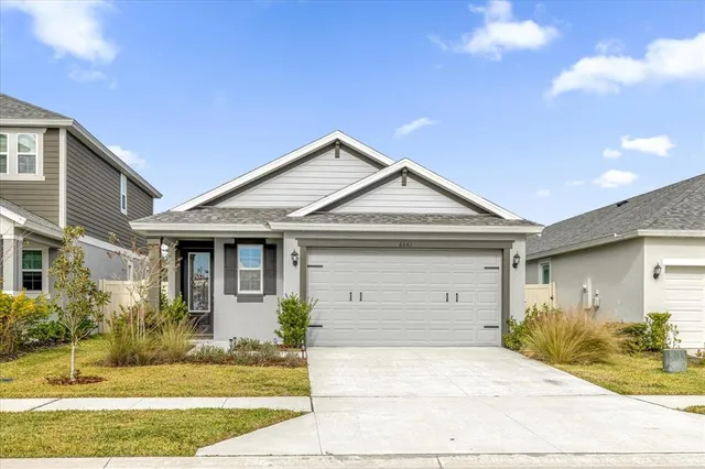 a view of house and garage