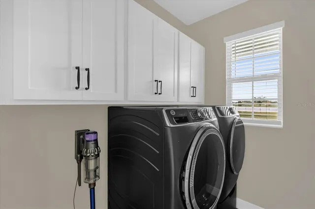 a utility room with dryer and washer