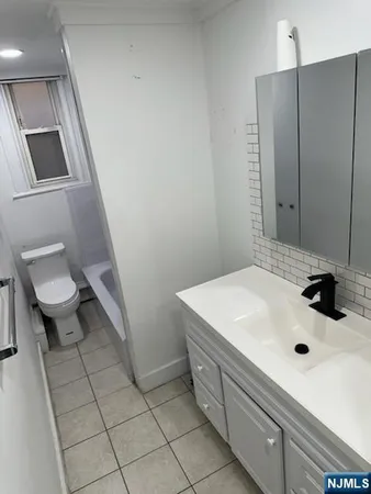 a bathroom with a sink and a toilet