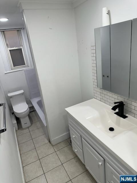 900 River Road, Unit 2A Edgewater, NJ 07020 - Photo 3 of 12 a bathroom with a sink and a toilet