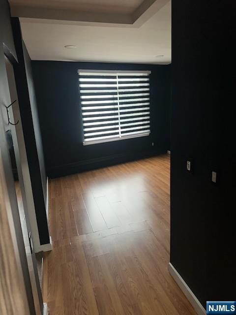 900 River Road, Unit 2A Edgewater, NJ 07020 - Photo 4 of 12 a view of a room with wooden floor and a window