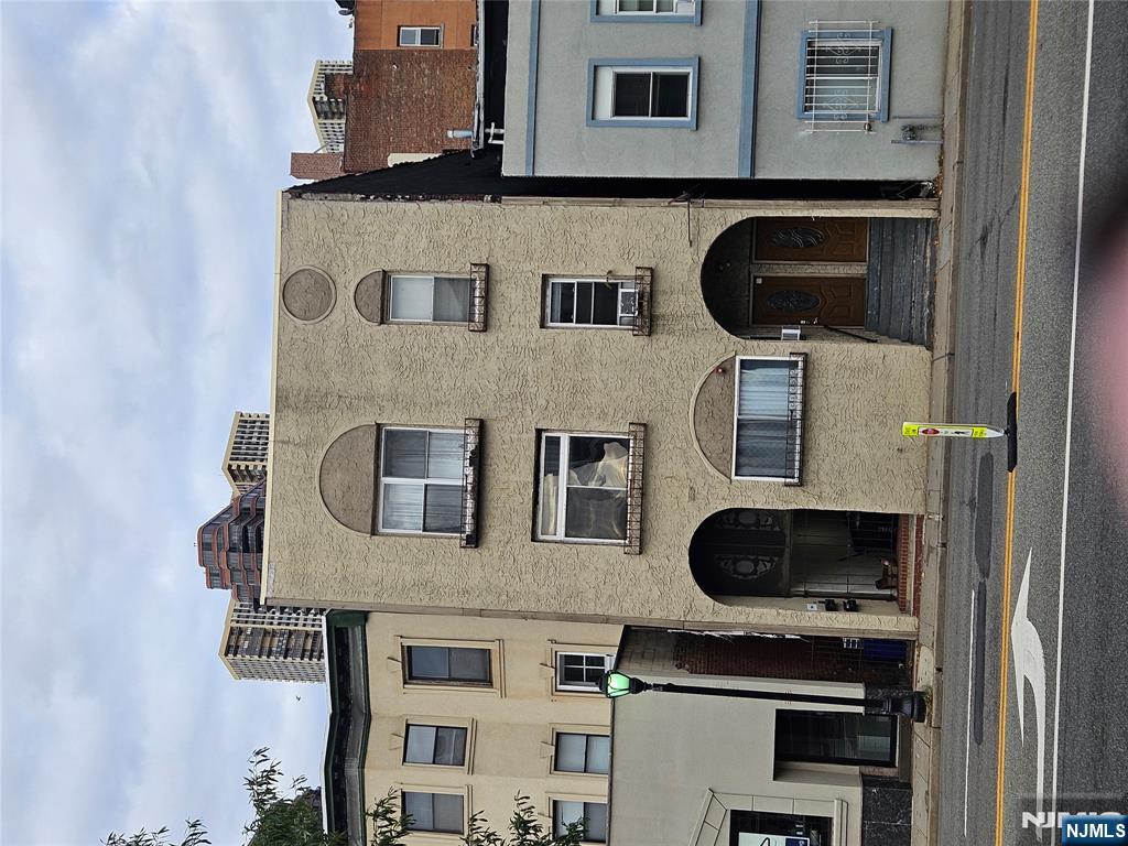 900 River Road, Unit 2A Edgewater, NJ 07020 - Photo 8 of 12 a view of a building with a balcony