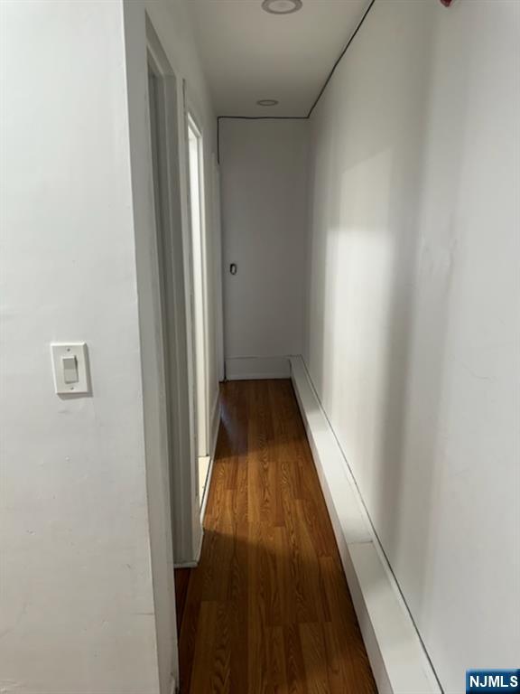 900 River Road, Unit 2A Edgewater, NJ 07020 - Photo 9 of 12 a view of a hallway with wooden floor