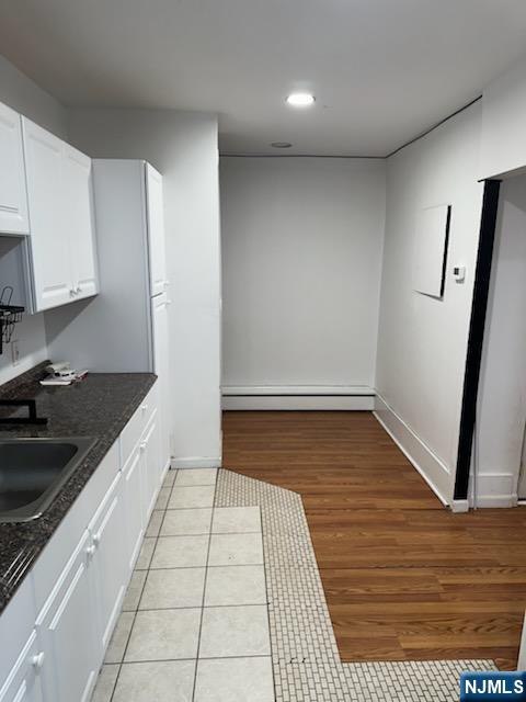 900 River Road, Unit 2A Edgewater, NJ 07020 - Photo 10 of 12 a kitchen with granite countertop a sink and a stove top oven