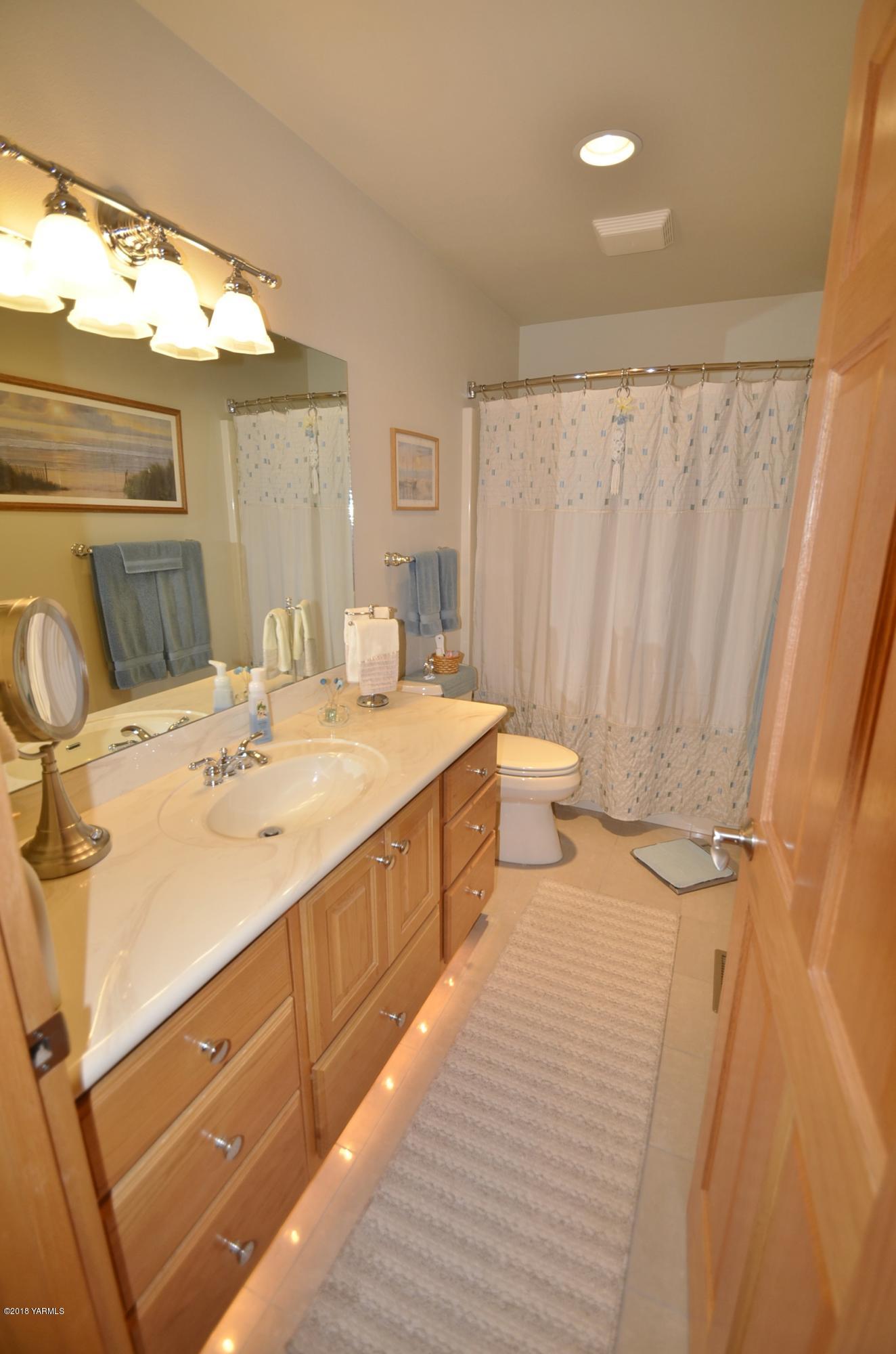 9000 Mieras Road Yakima, WA 98901 - Photo 22 of 63 a bathroom with a double vanity sink and mirror
