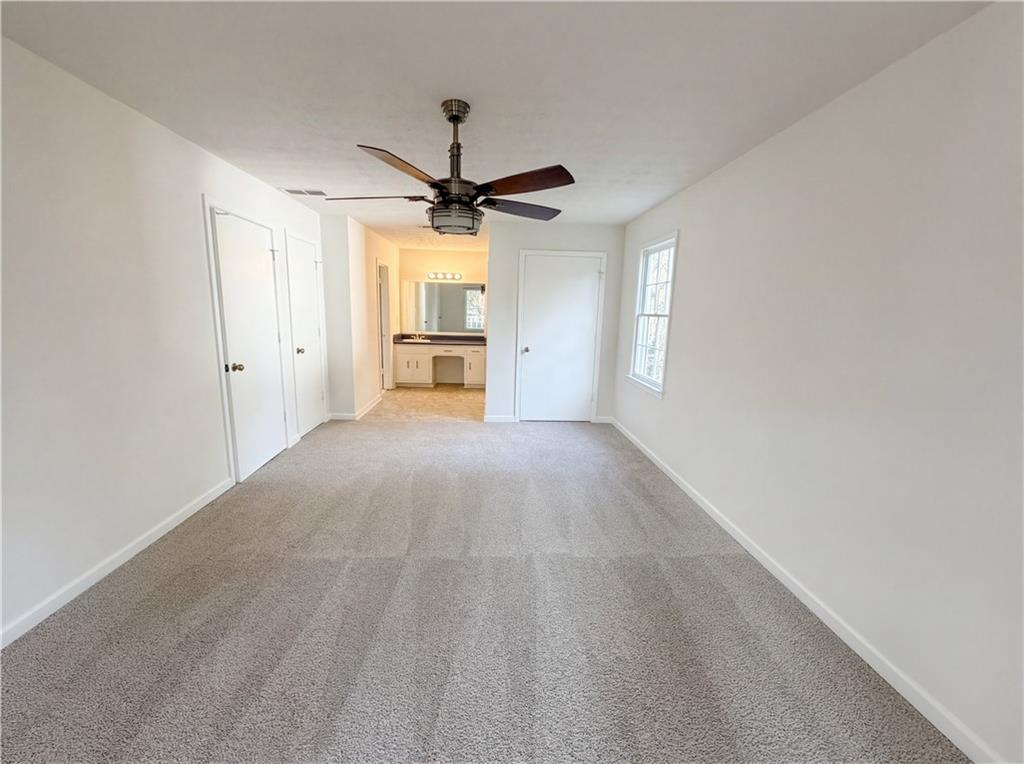 197 Rockbridge Road Southwest Lilburn, GA 30047 - Photo 13 of 27 a view of a kitchen with a sink and a window