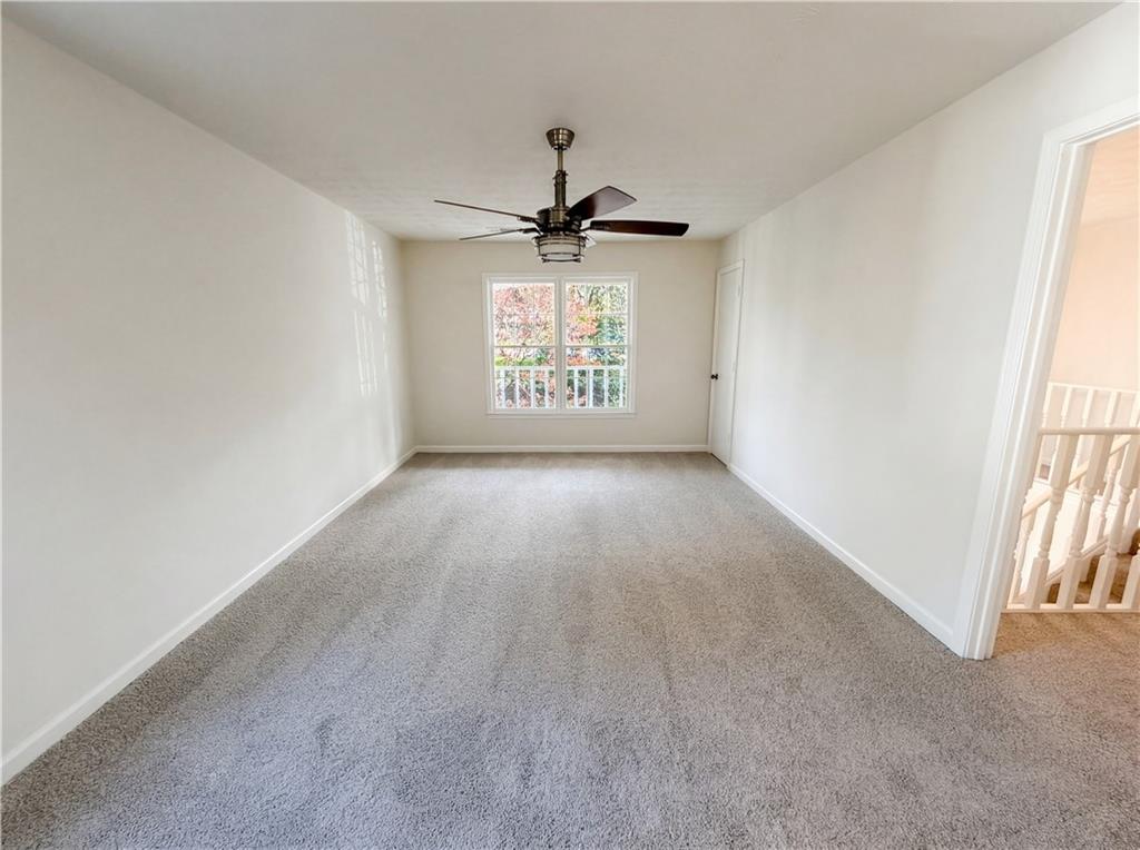 197 Rockbridge Road Southwest Lilburn, GA 30047 - Photo 14 of 27 a view of an empty room and window