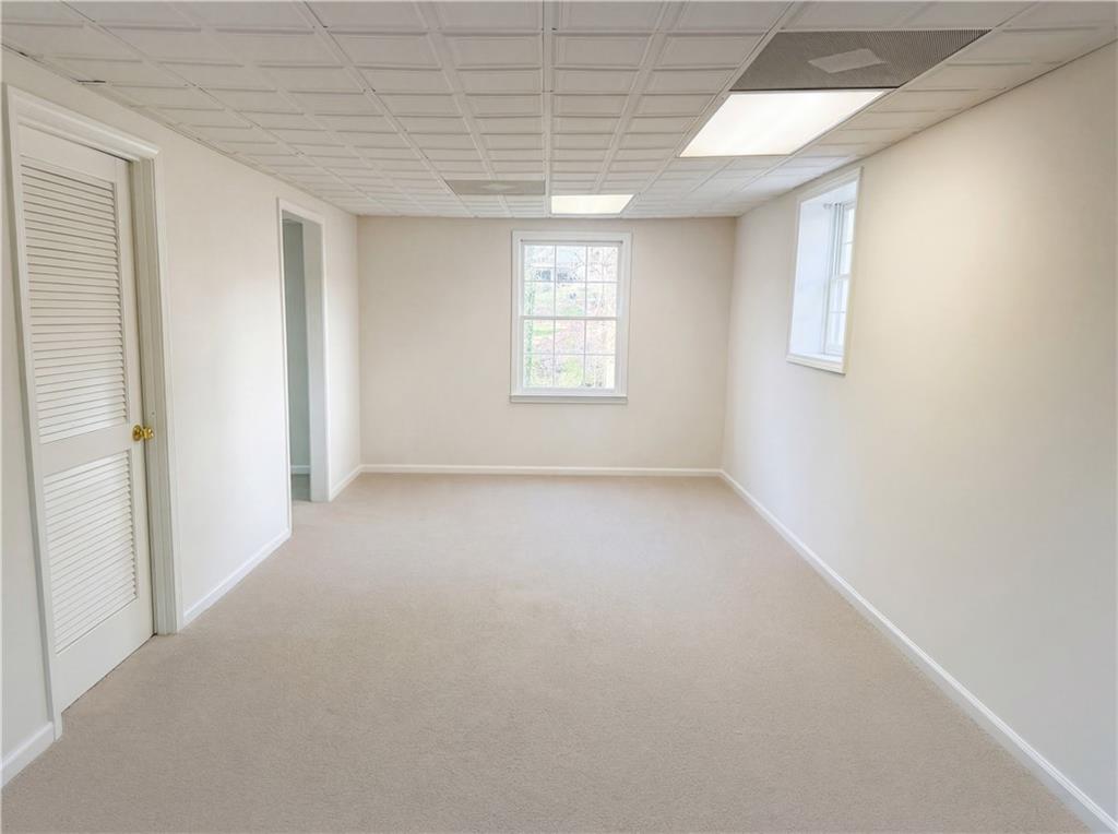 197 Rockbridge Road Southwest Lilburn, GA 30047 - Photo 19 of 27 an empty room with a windows