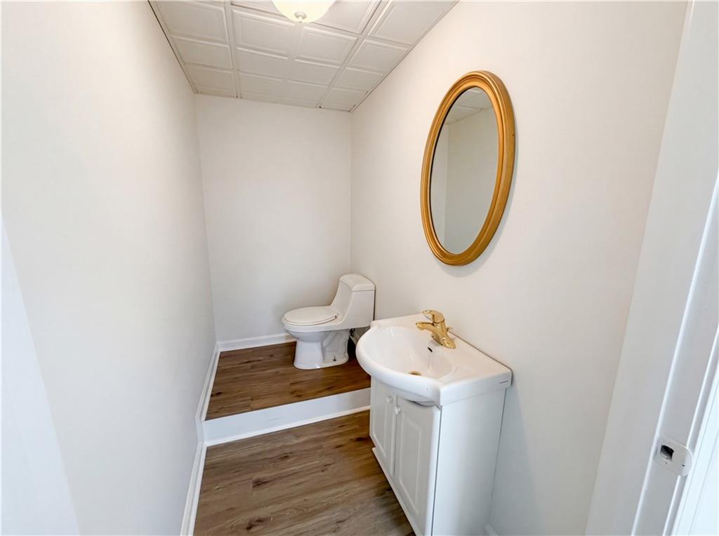 197 Rockbridge Road Southwest Lilburn, GA 30047 - Photo 25 of 27 a bathroom with a sink and a mirror