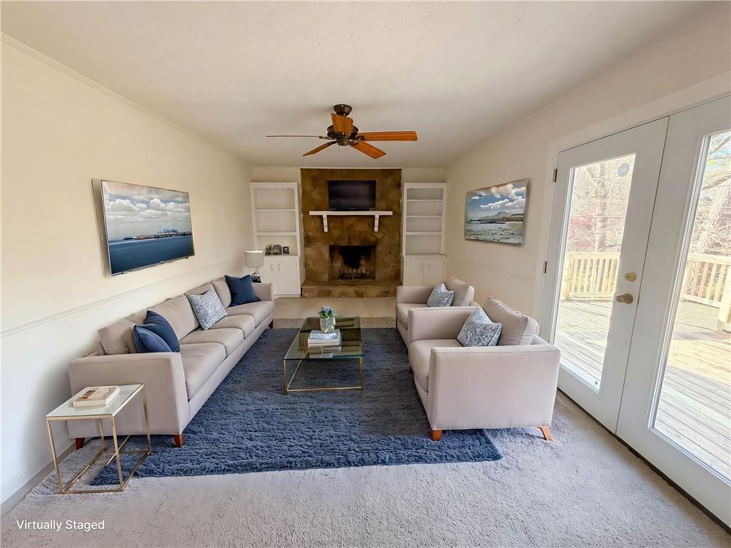197 Rockbridge Road Southwest Lilburn, GA 30047 - Photo 3 of 27 a living room with furniture a rug and a window