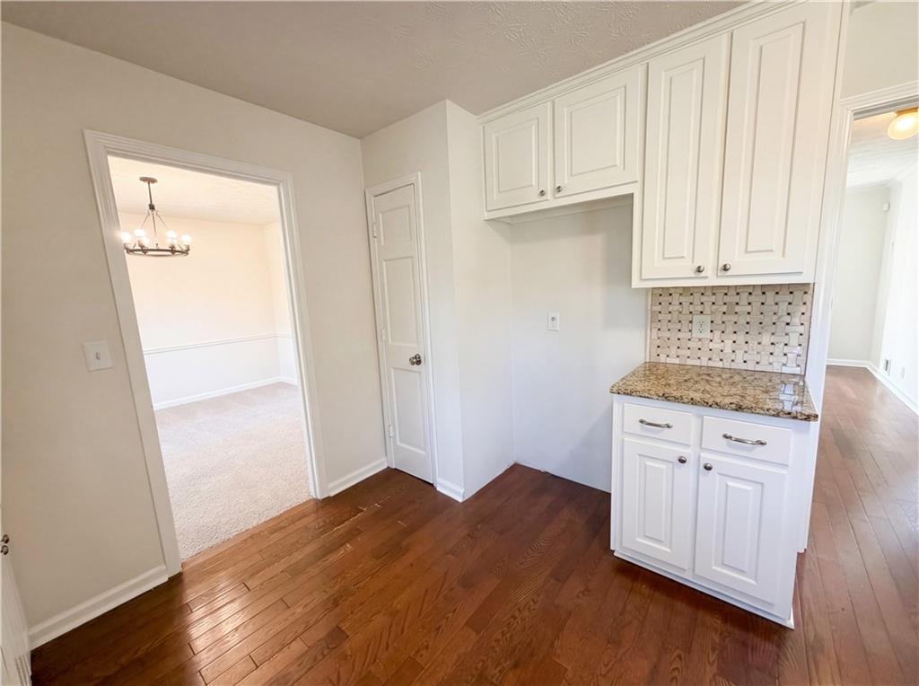 197 Rockbridge Road Southwest Lilburn, GA 30047 - Photo 10 of 27 a view of kitchen with wooden floor