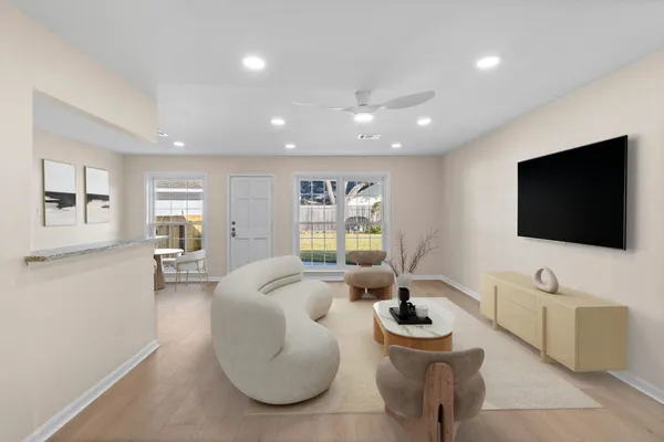 a living room with furniture and a flat screen tv