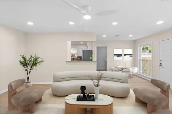 a living room with furniture and a large window