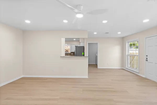 a view of kitchen and wooden floor