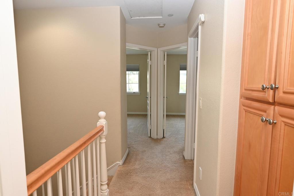 4035 Bluff View Way Carlsbad, CA 92008 - Photo 17 of 38 a view of a hallway with a white walls
