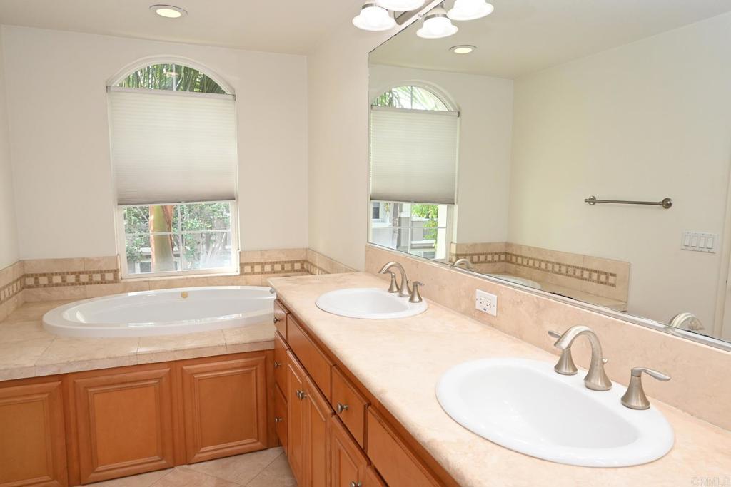 4035 Bluff View Way Carlsbad, CA 92008 - Photo 21 of 38 a bathroom with a sink and a mirror