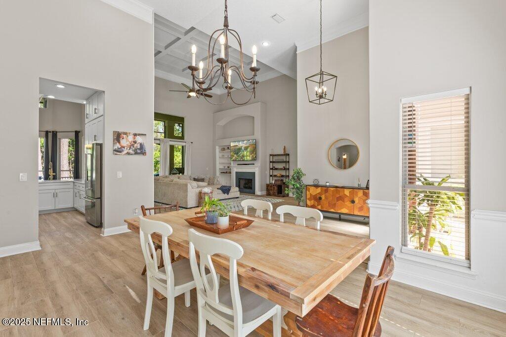 2676 Country Side Drive Fleming Island, FL 32003 - Photo 13 of 125 a view of a dining room with furniture window and wooden floor