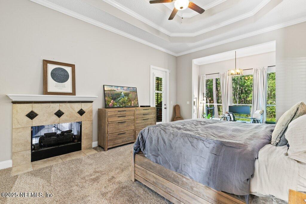 2676 Country Side Drive Fleming Island, FL 32003 - Photo 17 of 125 a bed sitting in a spacious bedroom next to a window