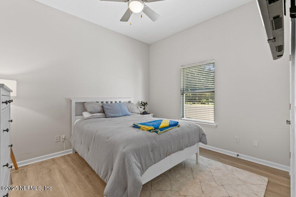 2676 Country Side Drive Fleming Island, FL 32003 - Photo 40 of 125 a bedroom with a bed a window and dresser