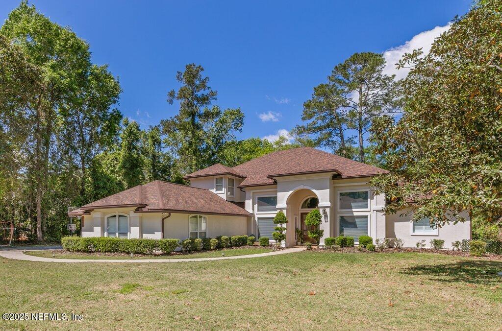 2676 Country Side Drive Fleming Island, FL 32003 - Photo 75 of 125 a front view of a house with a yard