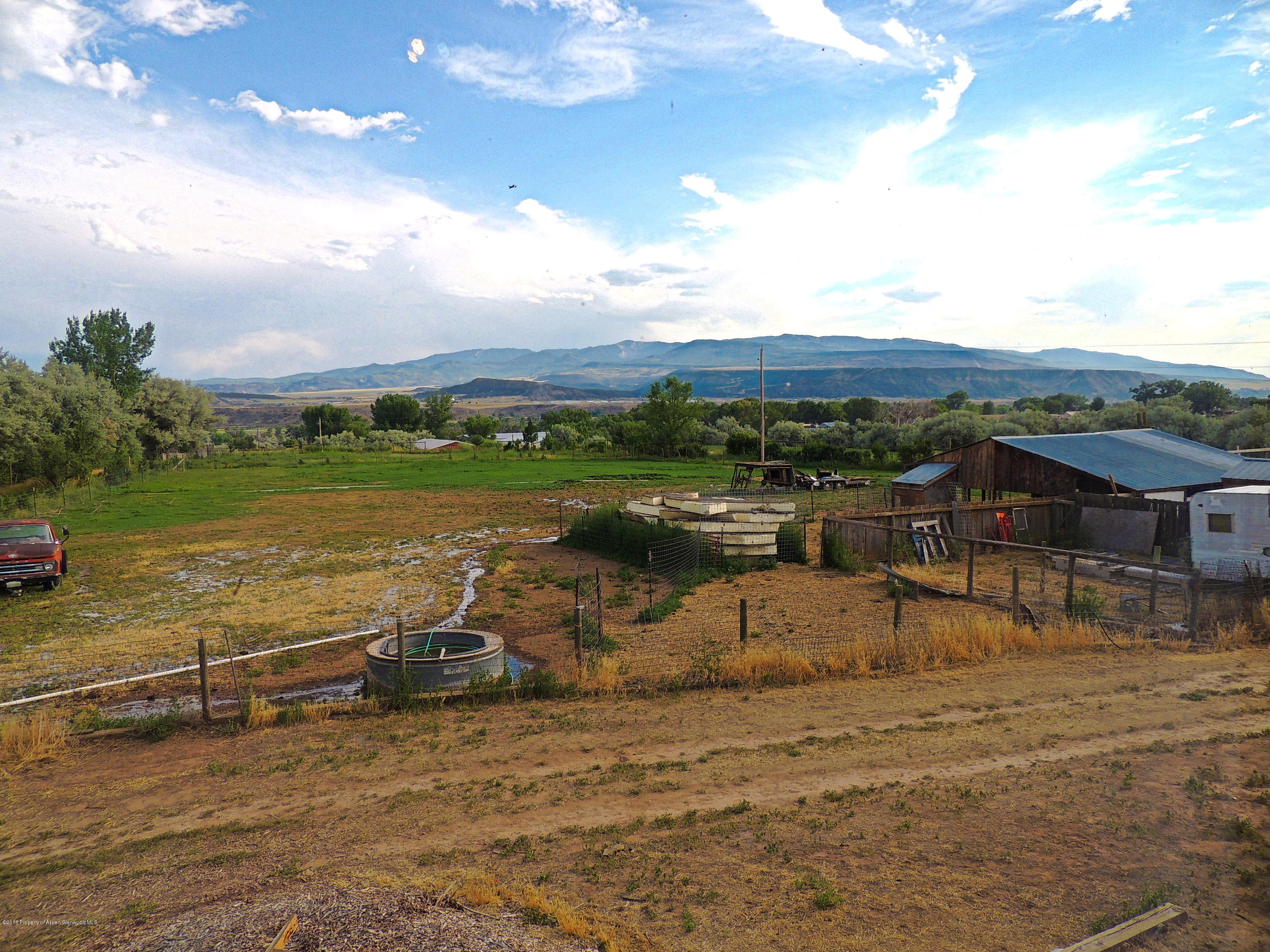 277 Miller Lane Rifle, CO 81650 - Photo 11 of 22 a view of a lake with a big yard