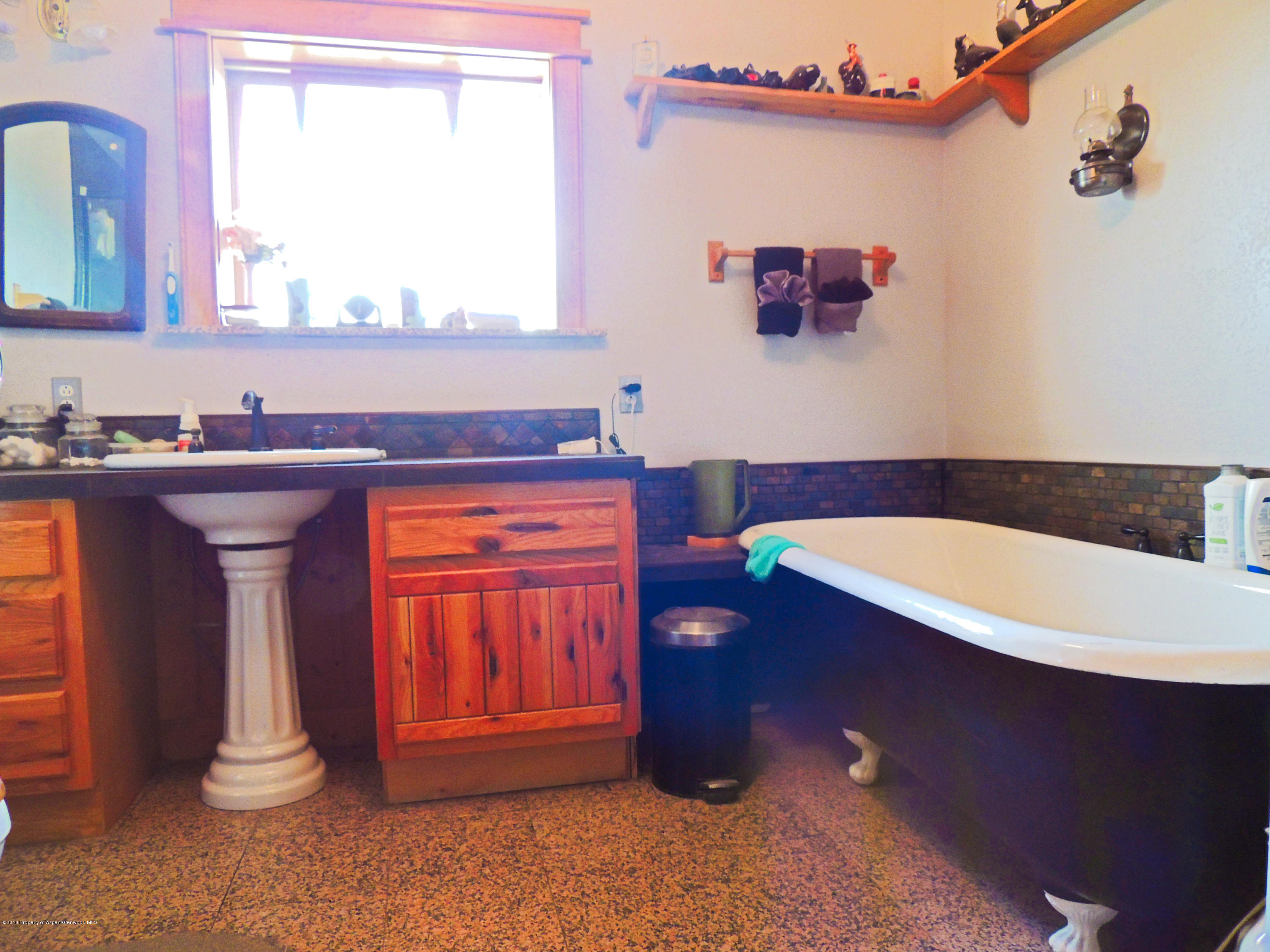 277 Miller Lane Rifle, CO 81650 - Photo 14 of 22 a bathroom with a sink and a bathtub
