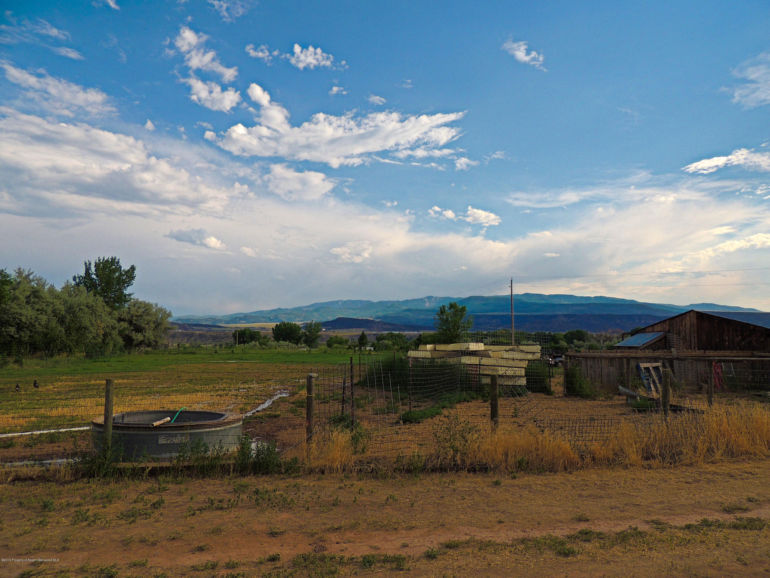 277 Miller Lane Rifle, CO 81650 - Photo 7 of 22 a view of a lake with houses in the background