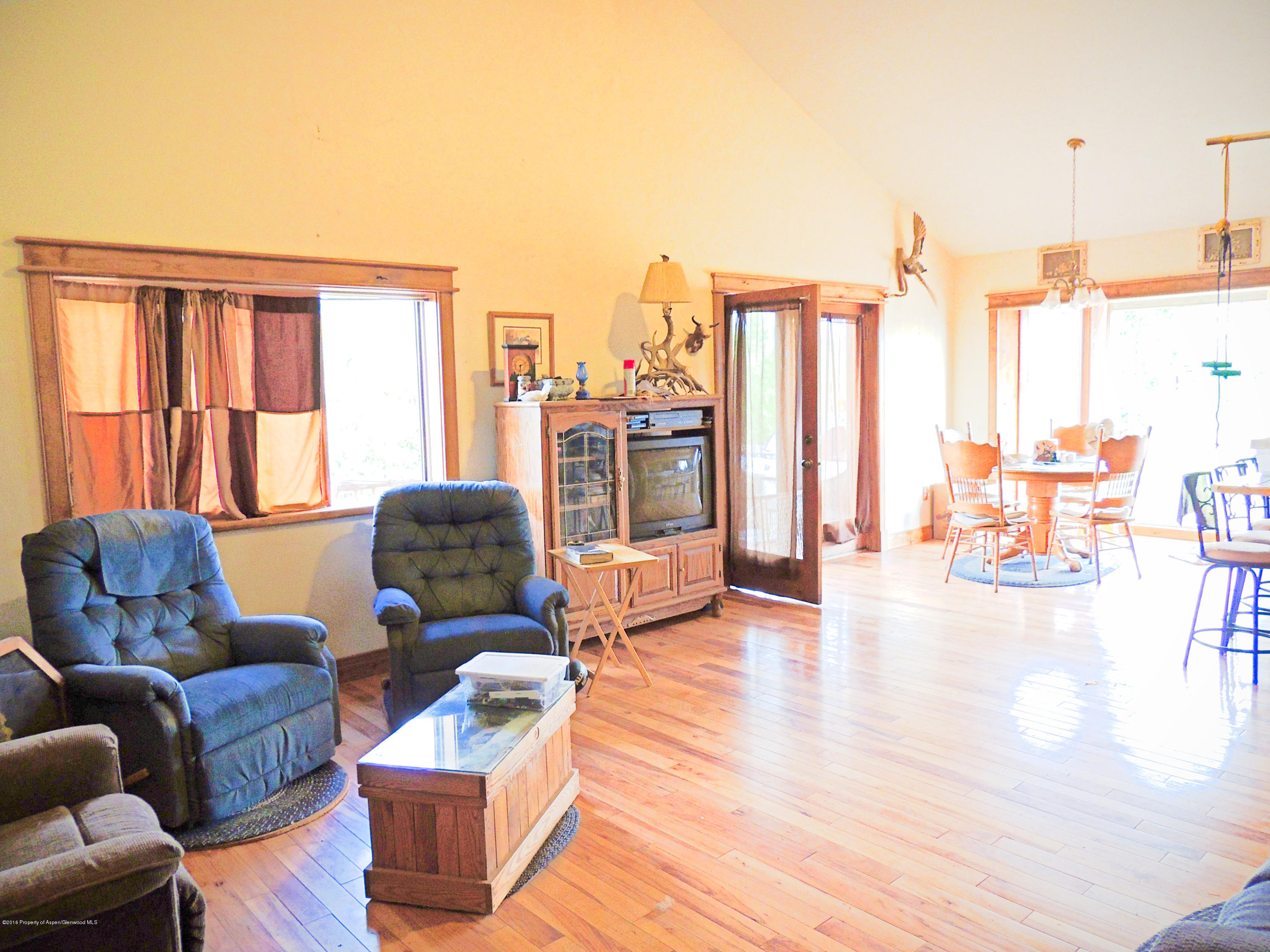 277 Miller Lane Rifle, CO 81650 - Photo 10 of 22 a living room with furniture and large windows