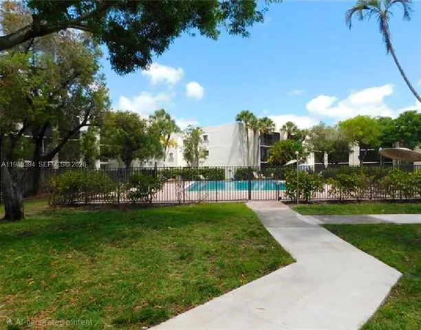 a view of a backyard with swimming pool
