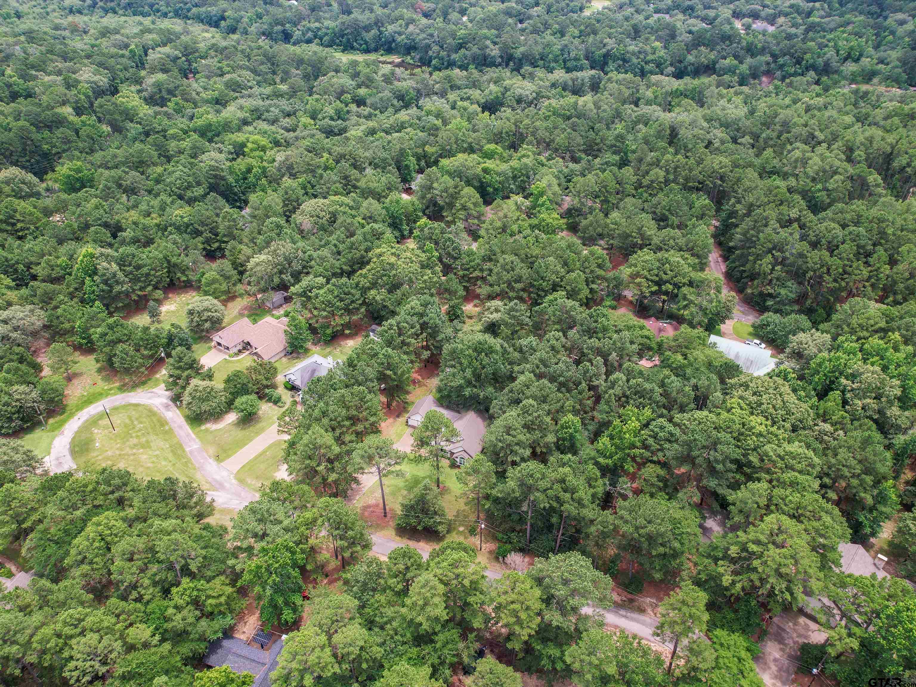 204 Pack Saddle Holly Lake Ranch, TX 75765 - Photo 5 of 11 an aerial view of a residential houses with yard and outdoor seating