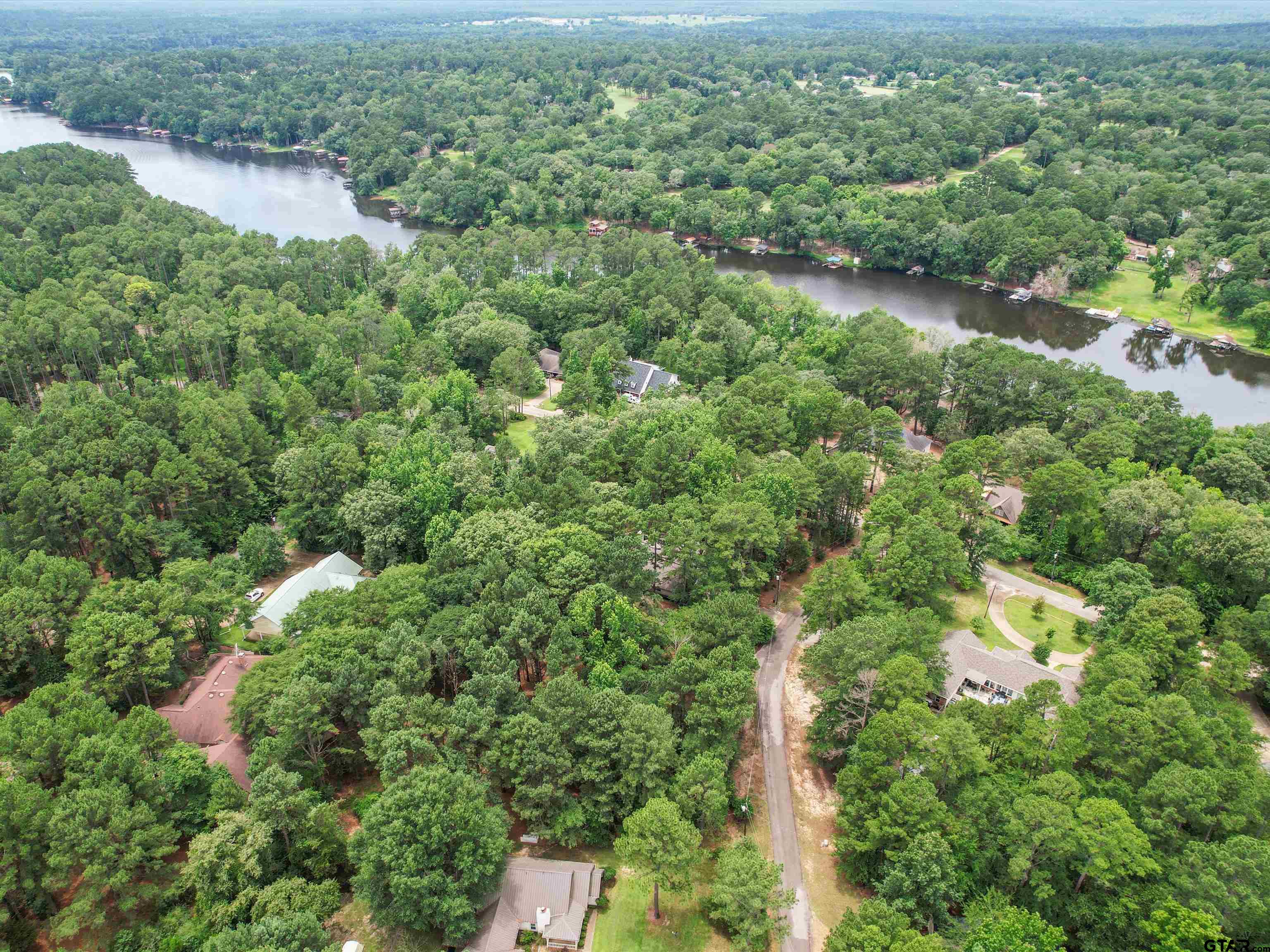 204 Pack Saddle Holly Lake Ranch, TX 75765 - Photo 10 of 11 an aerial view of residential houses with outdoor space and trees