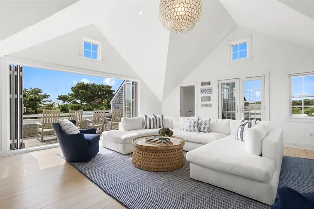 a living room with furniture and a table