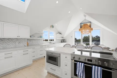 a terrace with outdoor seating and city view