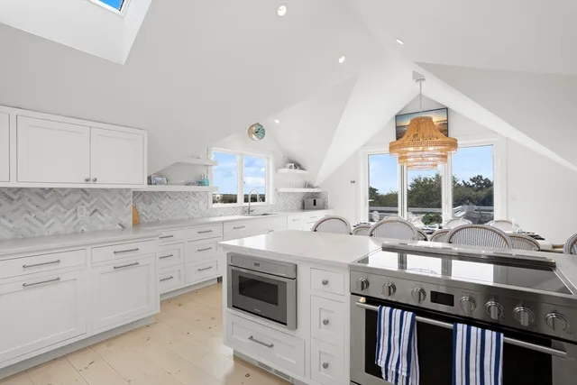 a terrace with outdoor seating and city view