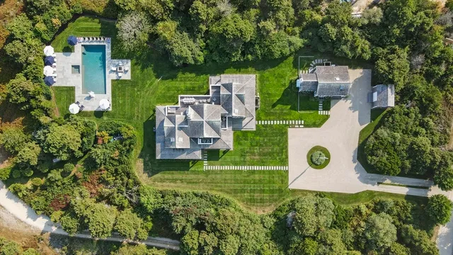 an aerial view of a house with a garden