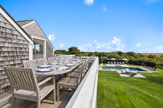a view of balcony with furniture and wooden deck