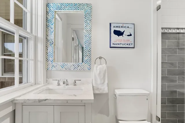 a bathroom with a shower and a toilet