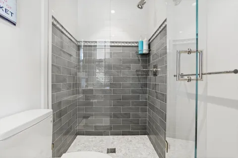 a bedroom with a large bed and a couch