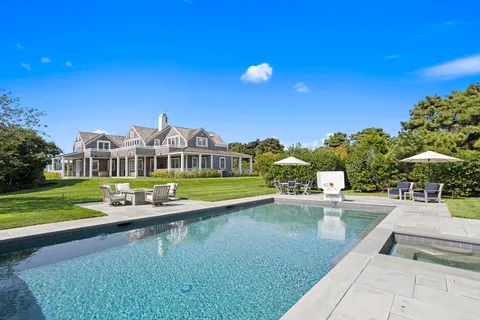 a view of a lake with a house in the background