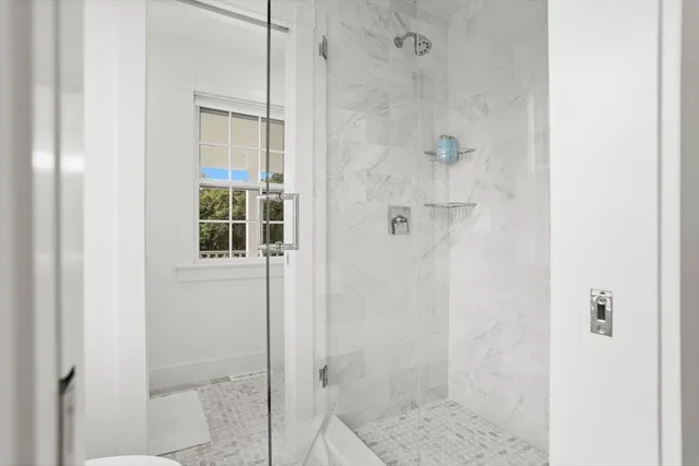 a large white bed in a white room