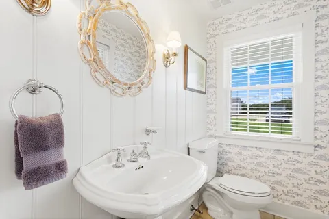 a large white bed in a white room