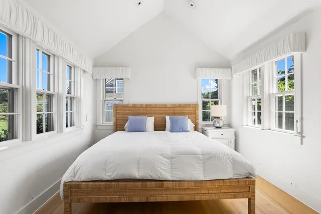 a front view of a house with a garden and porch