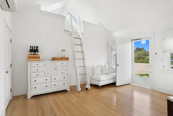 a view of backyard with seating space and deck