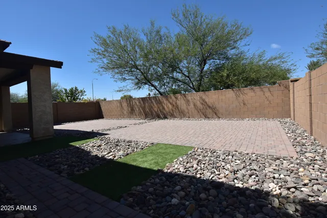 a view of a kitchen with a sink and a refrigerator
