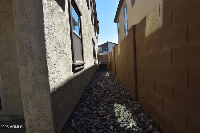 a kitchen with kitchen island granite countertop a sink a counter top stainless steel appliances and cabinets