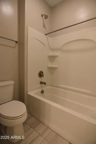 a bathroom with a sink a bathtub and window